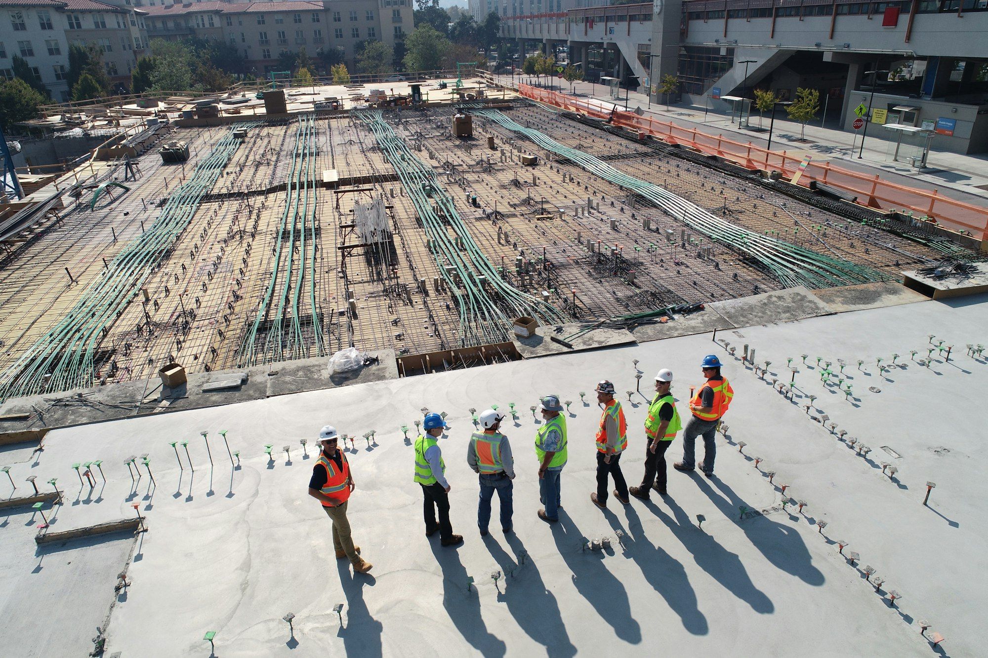 Crew preparing a large concrete slab pour